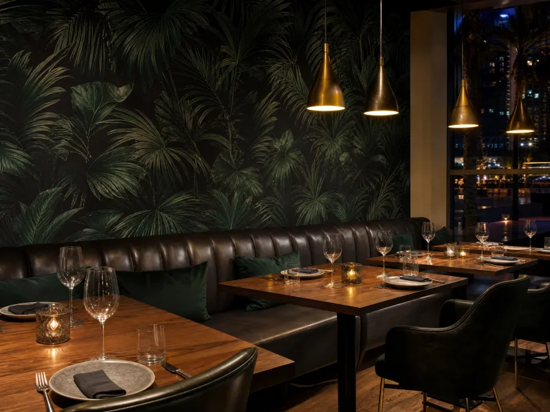 Dark botanical wallcovering in a restaurant dining room